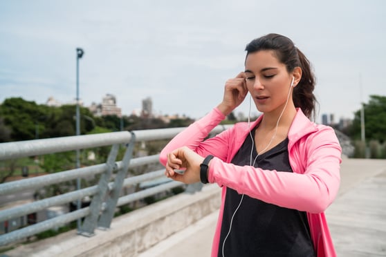 fitness-woman-checking-time-on-smart-watch-BEWUPFB