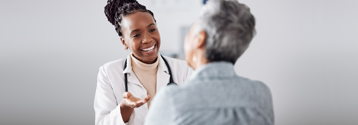 female doctor giving medical advice to an older male patient