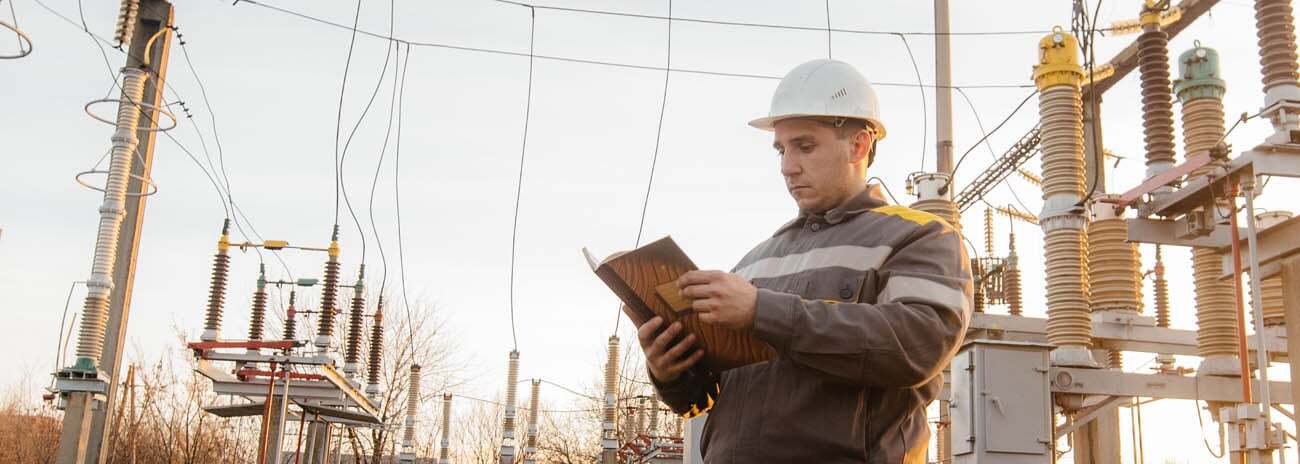 Engineer reviewing power systems in regulated utilities